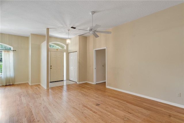 2615 15th St, Vero Beach, FL 32960 - spare room with plenty of natural light, light wood-style flooring, a textured ceiling, and a ceiling fan