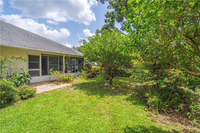 2615 15th St, Vero Beach, FL 32960 - view of grassy yard with a sunroom