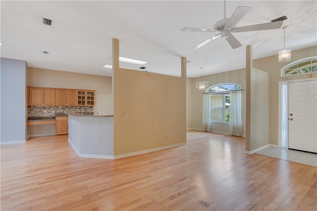 2615 15th St, Vero Beach, FL 32960 - entryway with a chandelier, light wood finished floors, and a ceiling fan
