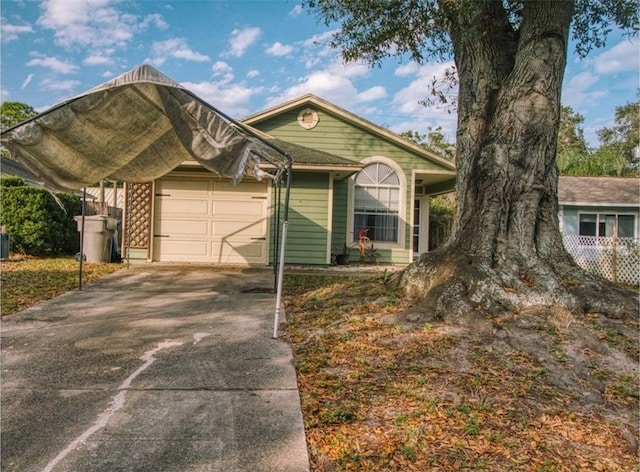 view of front facade featuring a garage and a carport