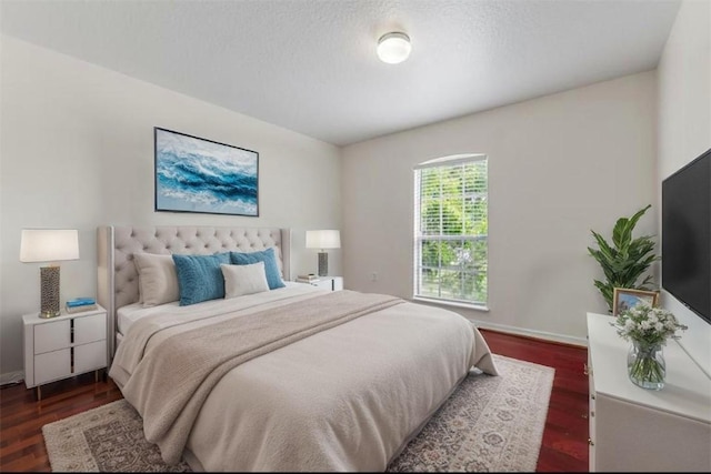 6057 Ridge Lake Cir, Vero Beach, FL 32967 - bedroom featuring dark wood-style flooring and baseboards