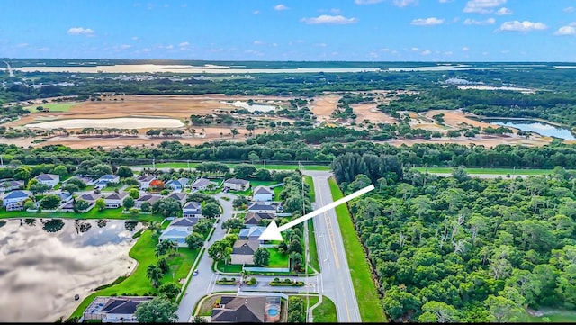 6057 Ridge Lake Cir, Vero Beach, FL 32967 - aerial view of residential area featuring a large body of water