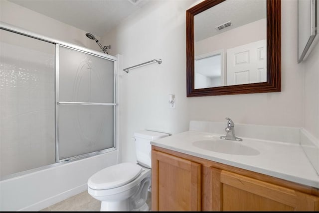 6057 Ridge Lake Cir, Vero Beach, FL 32967 - bathroom with vanity and bath / shower combo with glass door