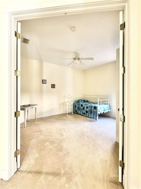 carpeted bedroom featuring ceiling fan