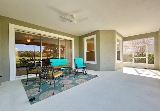 view of patio featuring ceiling fan