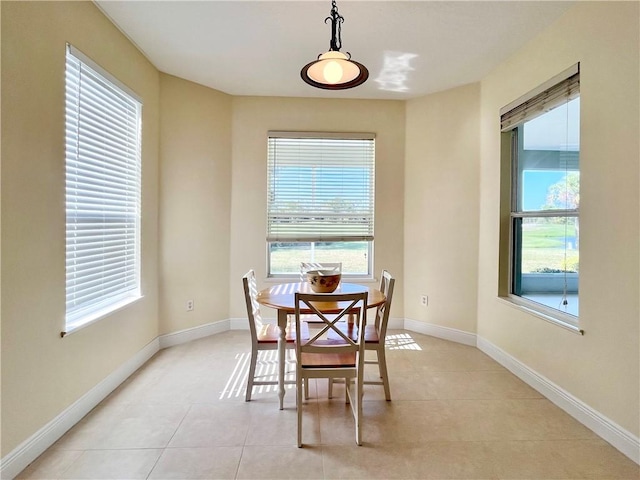 tiled dining area with a wealth of natural light