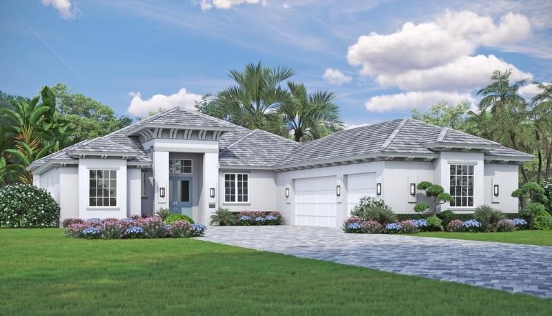 view of front of home featuring a garage and a front yard