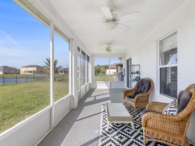 sunroom with ceiling fan