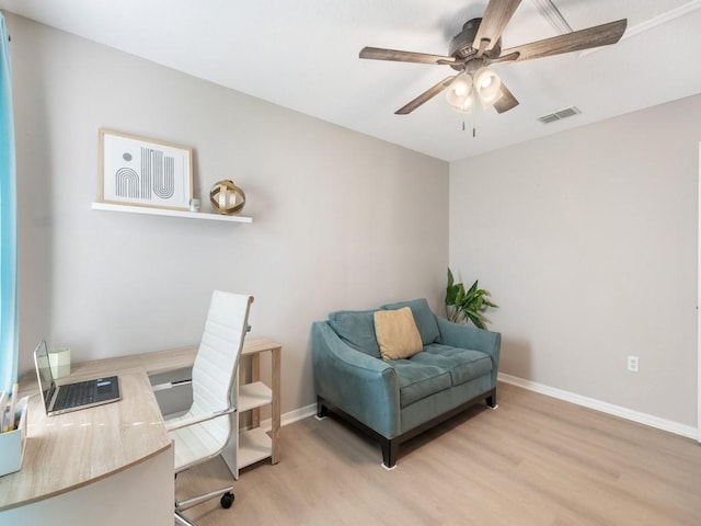 office space featuring baseboards, wood finished floors, visible vents, and ceiling fan