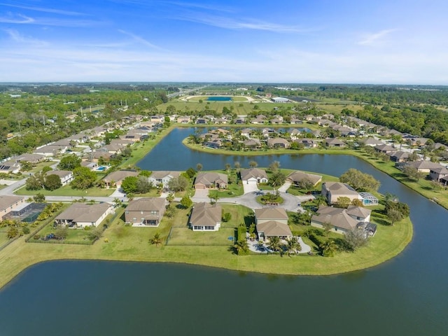 bird's eye view featuring a residential view and a water view