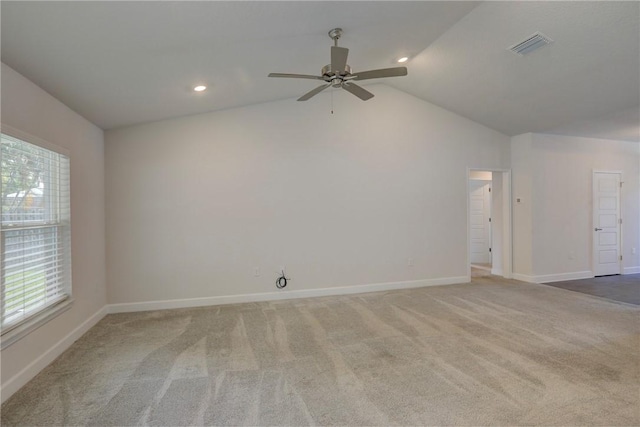 carpeted empty room featuring recessed lighting, visible vents, vaulted ceiling, ceiling fan, and baseboards