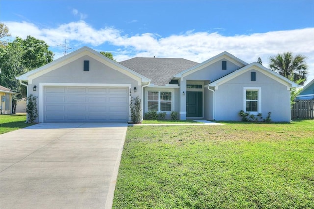 ranch-style home with stucco siding, concrete driveway, a front yard, fence, and a garage