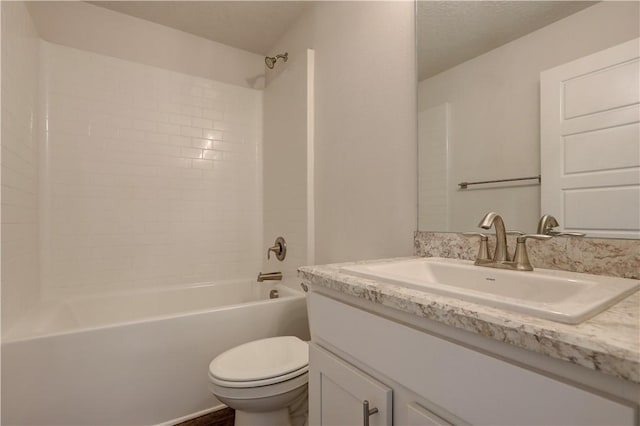 full bathroom with a textured ceiling, bathing tub / shower combination, vanity, and toilet