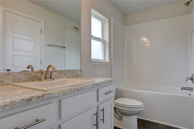 bathroom featuring shower / bath combination, vanity, toilet, and wood finished floors