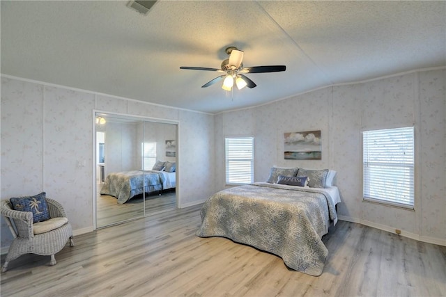 7519 Chasta Rd Unit 0, Micco, FL 32976 - bedroom featuring multiple windows, wood finished floors, crown molding, a textured ceiling, and a ceiling fan