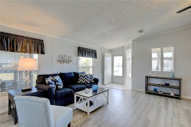 7519 Chasta Rd Unit 0, Micco, FL 32976 - living room with wood finished floors, a textured ceiling, baseboards, and a ceiling fan