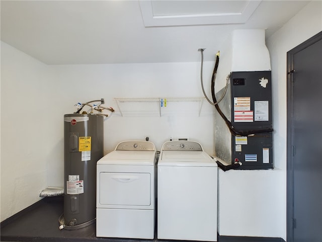 clothes washing area with water heater and washing machine and clothes dryer