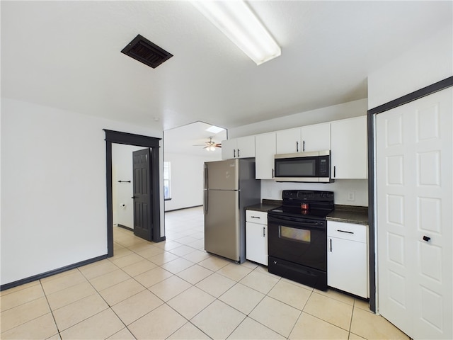 kitchen with white cabinetry, appliances with stainless steel finishes, light tile patterned floors, and ceiling fan