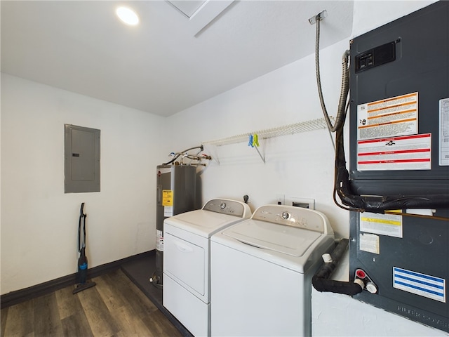 clothes washing area featuring heating unit, dark hardwood / wood-style flooring, electric panel, washing machine and dryer, and electric water heater