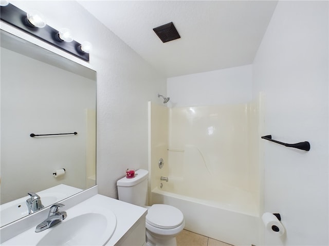 full bathroom featuring vanity, tile patterned floors, toilet, and washtub / shower combination