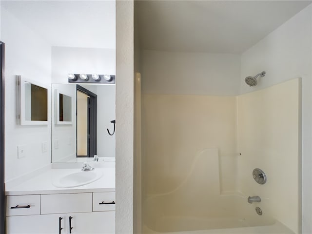 bathroom with vanity and bathing tub / shower combination