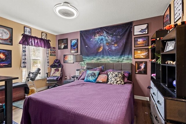 bedroom featuring hardwood / wood-style flooring