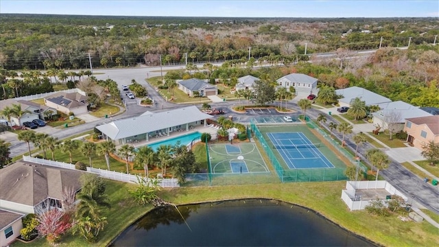 birds eye view of property with a water view