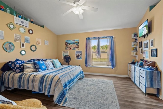 bedroom with lofted ceiling, hardwood / wood-style floors, and ceiling fan