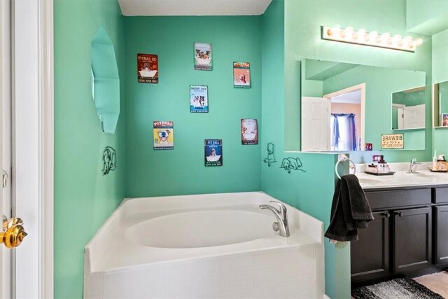 bathroom featuring vanity and a bathing tub