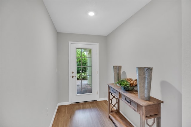 doorway with hardwood / wood-style floors