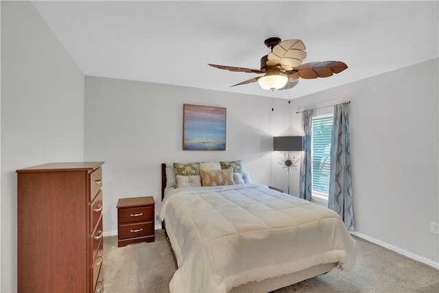 bedroom featuring light carpet and ceiling fan