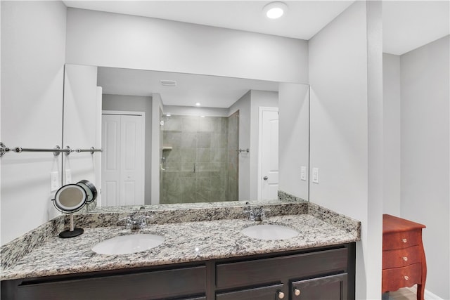 bathroom featuring vanity and an enclosed shower