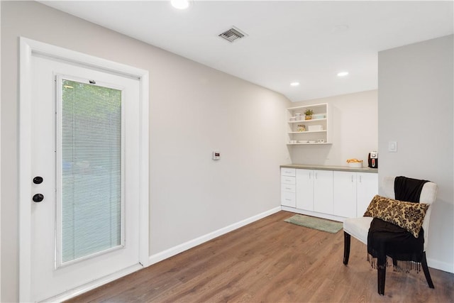 sitting room with wood-type flooring