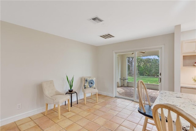 dining space featuring light tile patterned floors