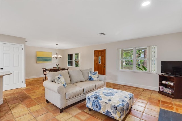 living room with a notable chandelier