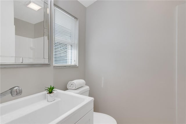 bathroom featuring sink and toilet