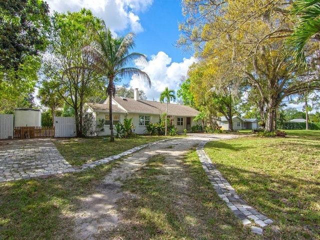 ranch-style house with a front yard