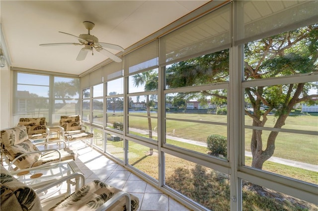 sunroom / solarium with ceiling fan and a healthy amount of sunlight