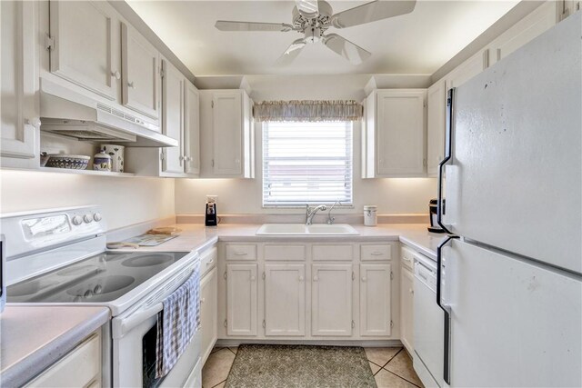 kitchen with white cabinetry, white appliances, sink, and light tile patterned floors