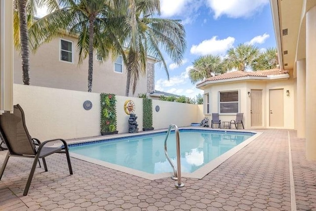 view of pool featuring a patio