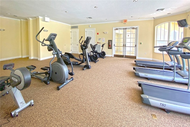 gym with a textured ceiling and ornamental molding