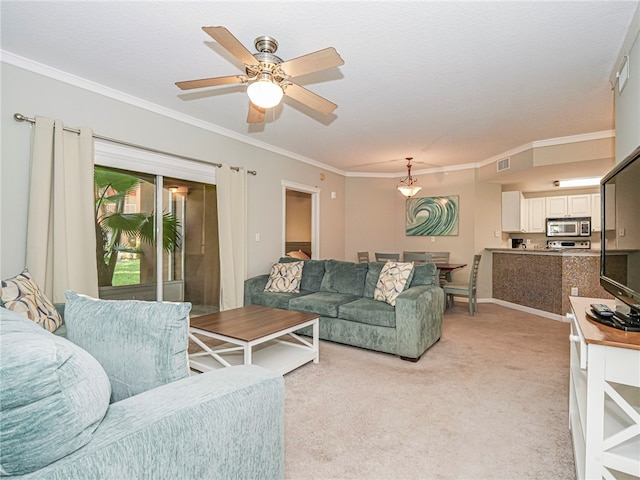 living room with ceiling fan, light colored carpet, and ornamental molding