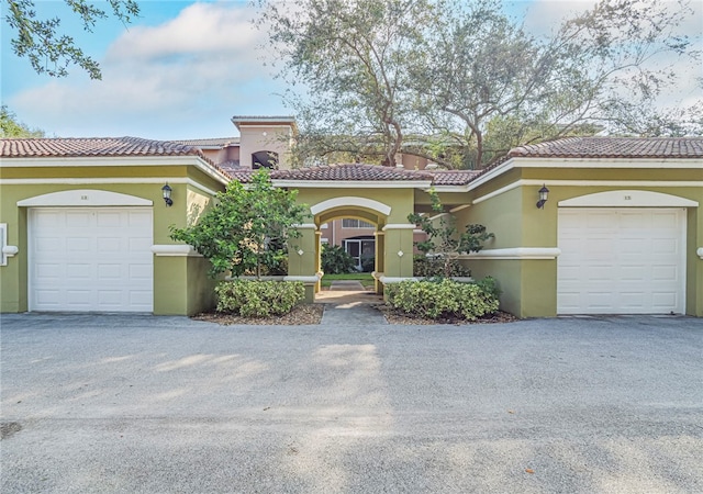 mediterranean / spanish-style house featuring a garage