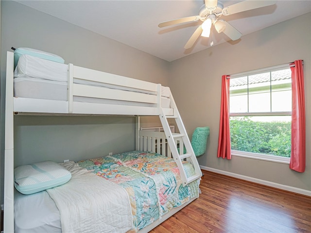 bedroom with hardwood / wood-style flooring and ceiling fan