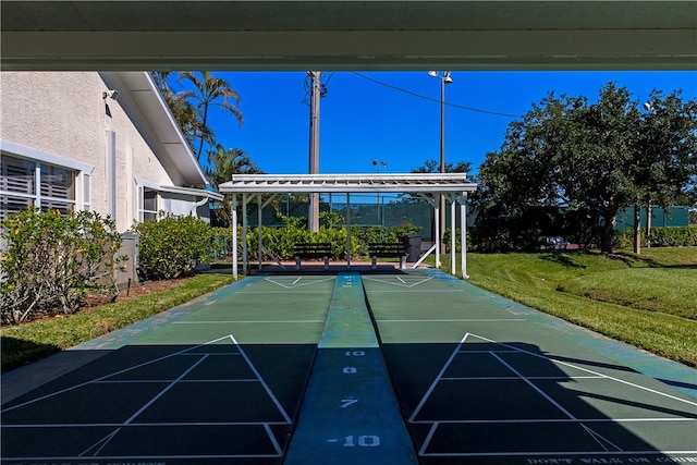 view of property's community featuring a yard