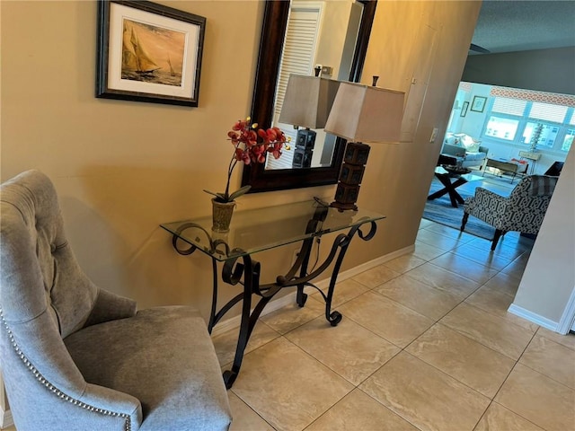 625 W Lake Jasmine Cir Unit 208, Vero Beach, FL 32962 - hall featuring baseboards and light tile patterned floors