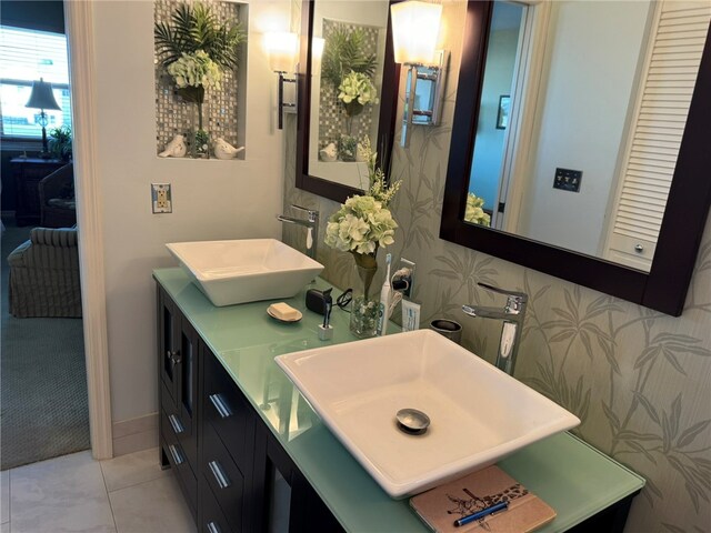 bathroom with tile patterned flooring and vanity