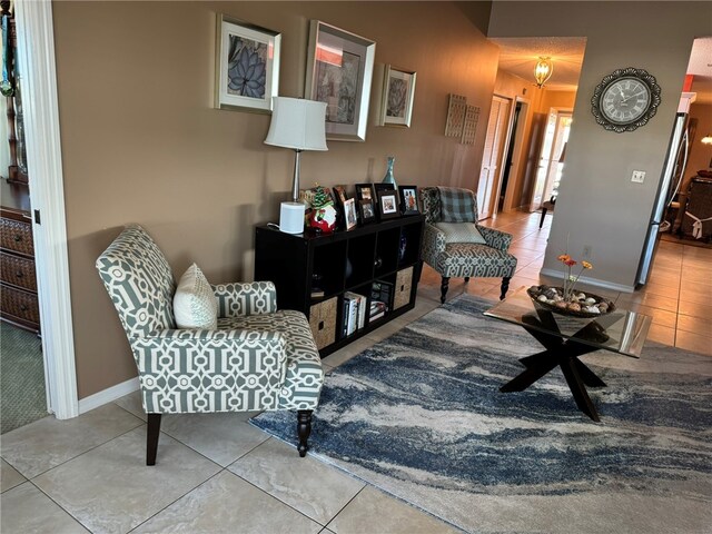 living area featuring tile patterned floors