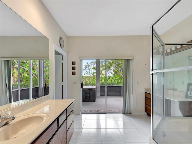 bathroom featuring baseboards, vanity, and tile patterned flooring