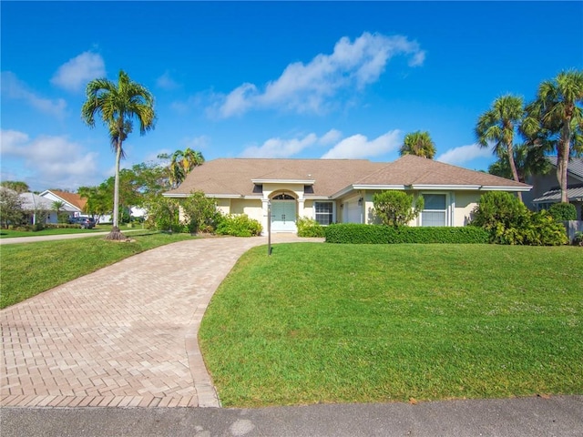 ranch-style house with a front lawn